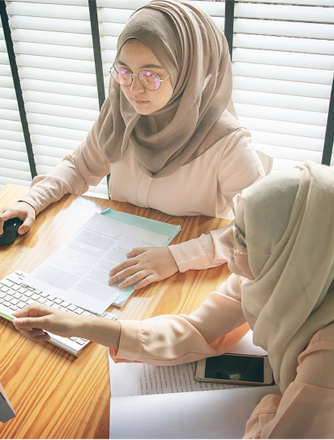 two female students studying together